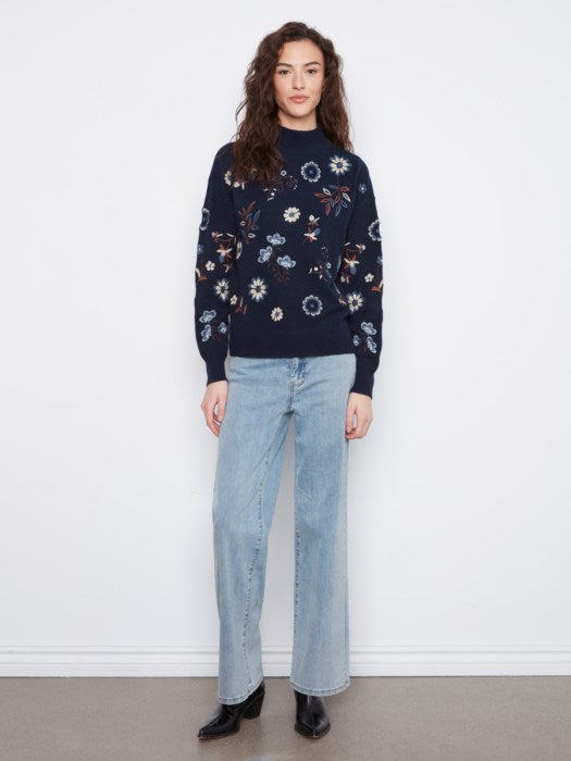 Pull brodé à col faux